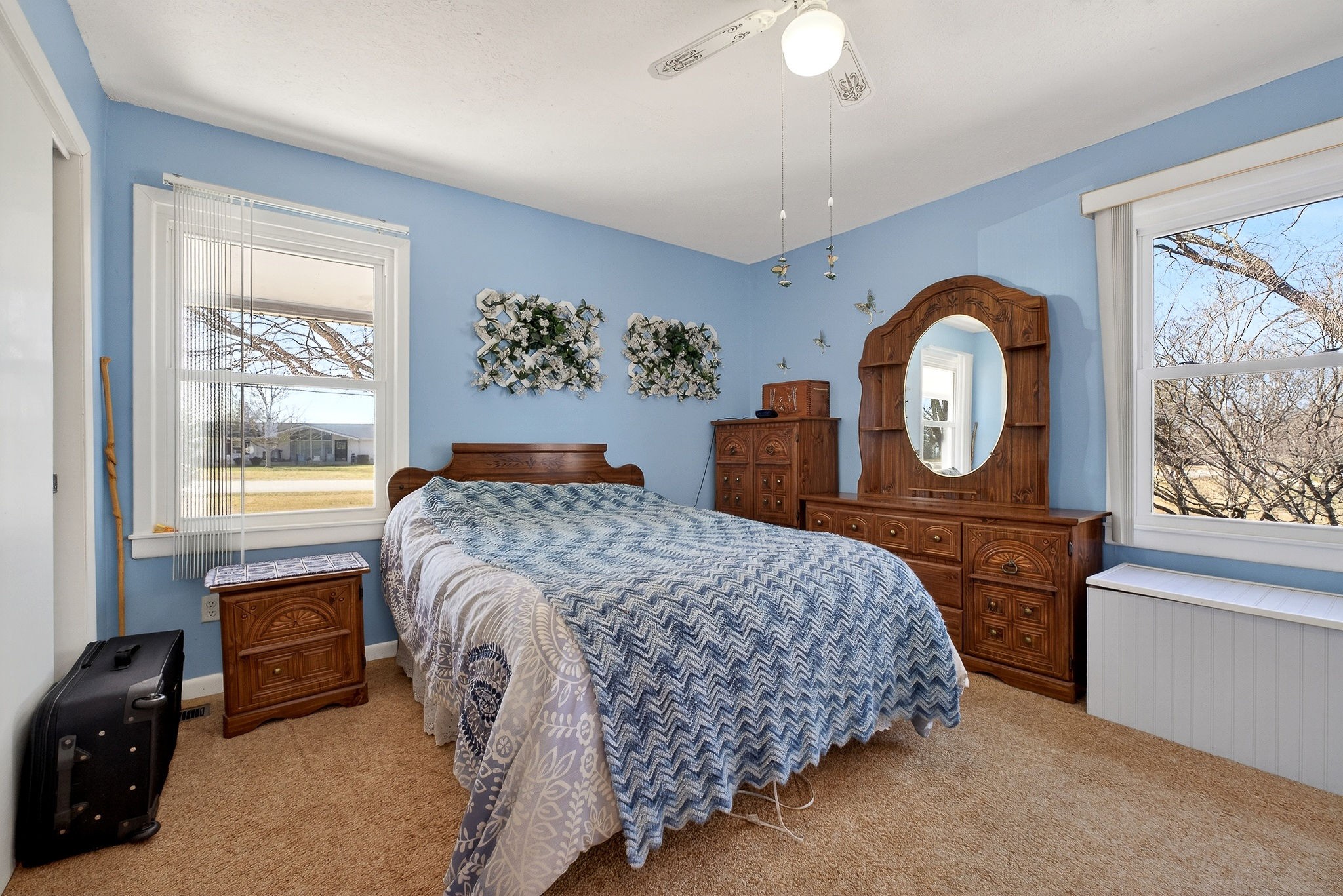 566 Turntable Road Sparta, TN 38583 - Photo 19 of 48 a bedroom with a bed a dresser and mirror