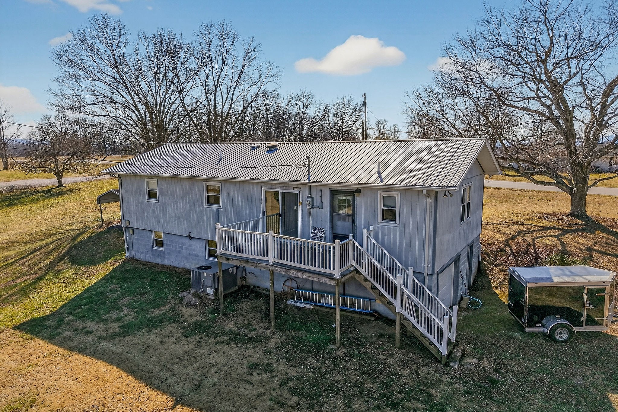 566 Turntable Road Sparta, TN 38583 - Photo 3 of 48 a view of a house with a yard and sitting area