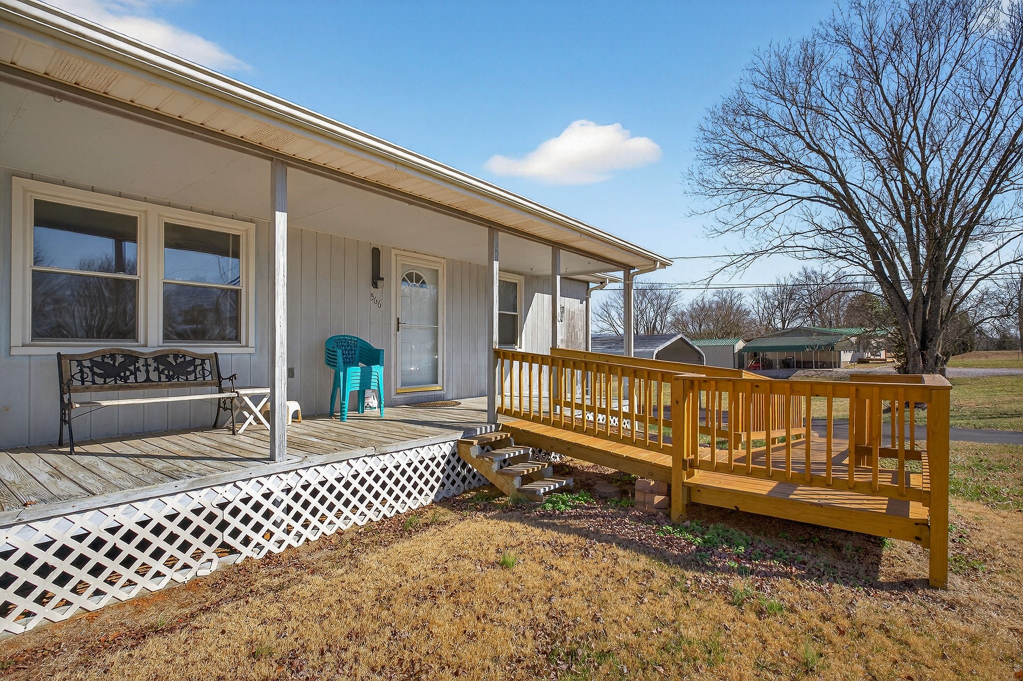 566 Turntable Road Sparta, TN 38583 - Photo 40 of 48 a view of a deck with a bench and wooden fence