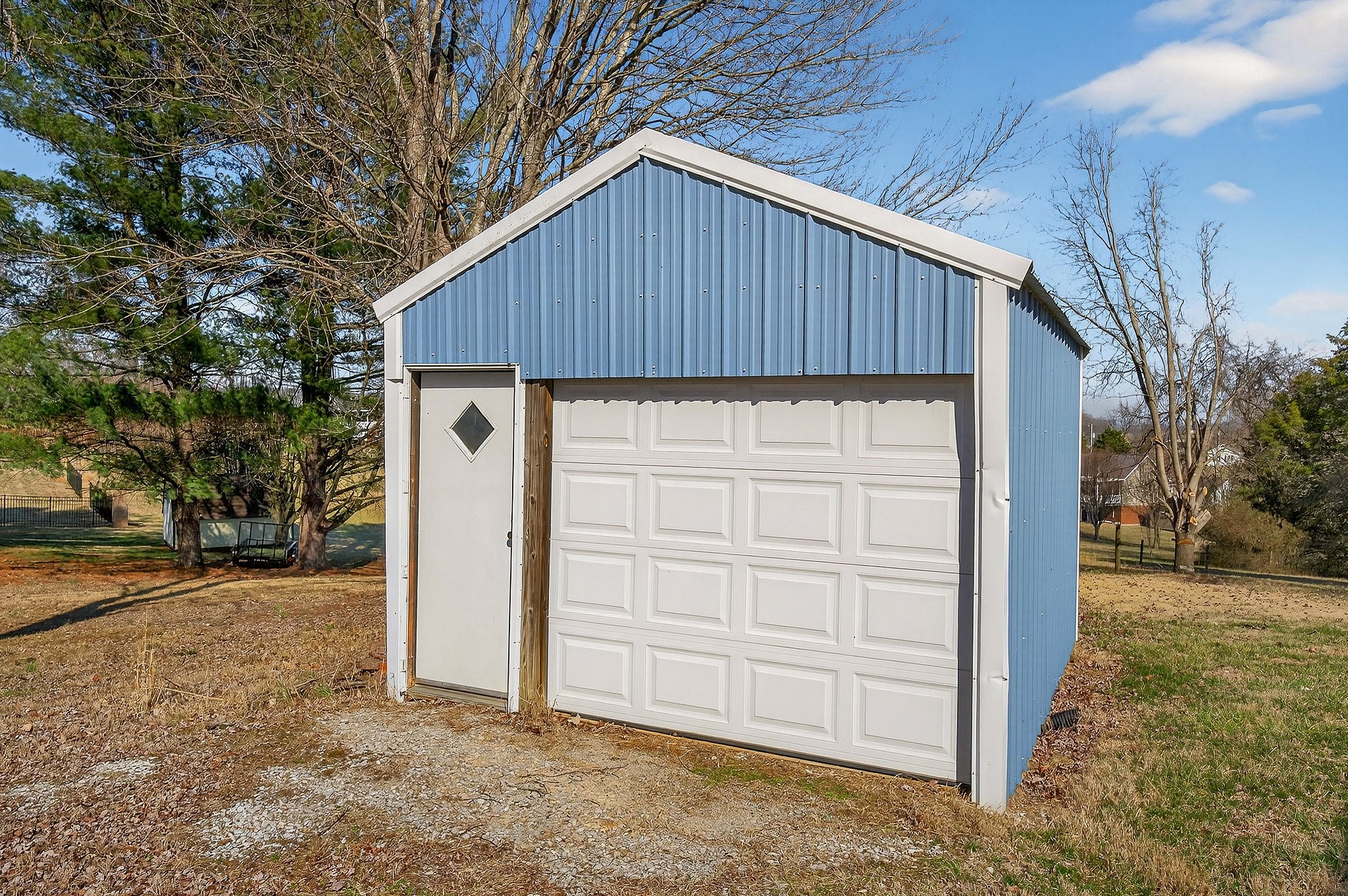 566 Turntable Road Sparta, TN 38583 - Photo 41 of 48 a view of a small house with backyard