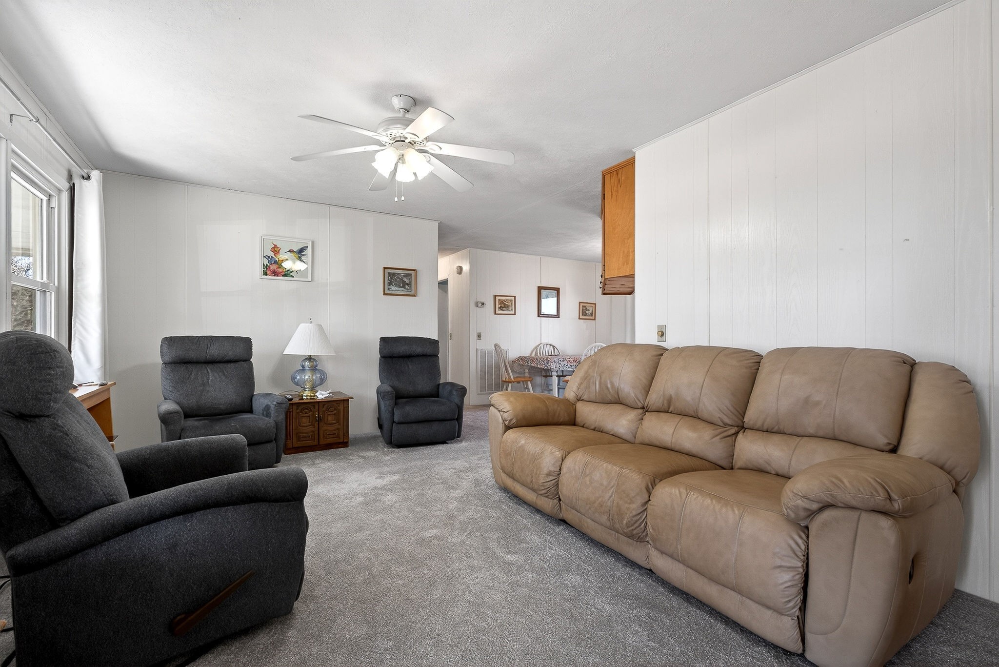 566 Turntable Road Sparta, TN 38583 - Photo 45 of 48 a living room with furniture a fireplace and a flat screen tv