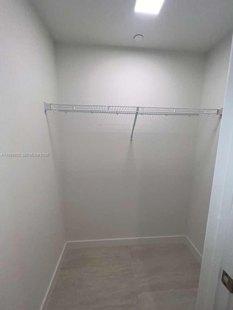 77 Southeast 5th, Unit 2004 Miami, FL 32311 - Photo 15 of 32 a view of small space with racks on the wall