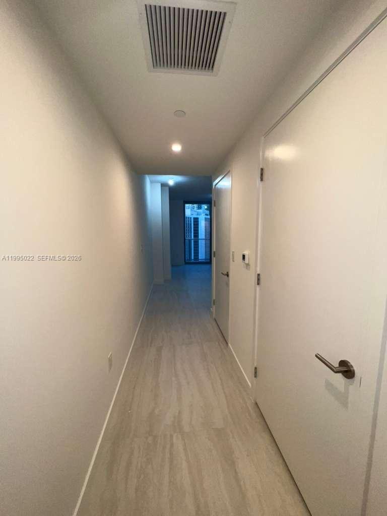 77 Southeast 5th, Unit 2004 Miami, FL 32311 - Photo 8 of 32 a view of a hallway