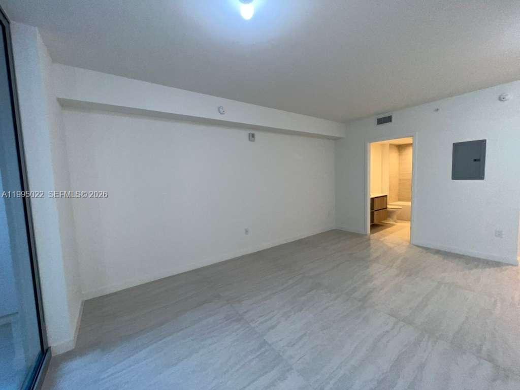 77 Southeast 5th, Unit 2004 Miami, FL 32311 - Photo 10 of 32 a view of empty room with wooden floor