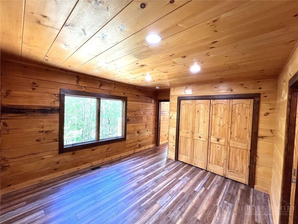 138 Talon Drive Boone, NC 28607 - Photo 12 of 25 a view of empty room with wooden floor and fan