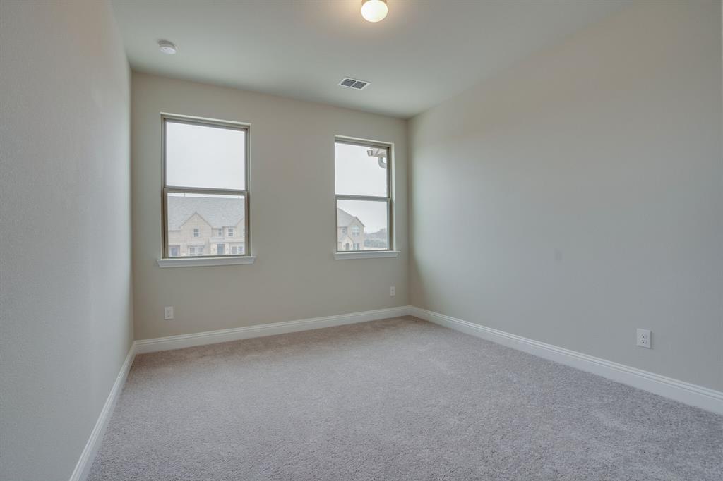 6217 Rainbow Valley Place Frisco, TX 75035 - Photo 25 of 30 an empty room with windows and closet