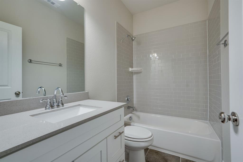 6217 Rainbow Valley Place Frisco, TX 75035 - Photo 27 of 30 a bathroom with a sink a toilet and shower
