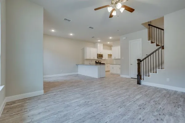 a view of kitchen with sink and window