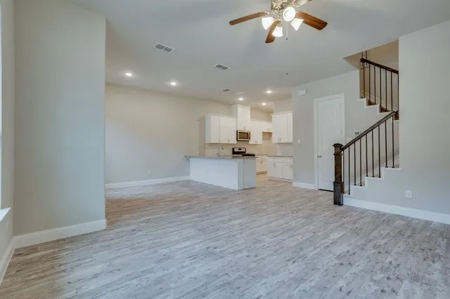 a view of kitchen with sink and window
