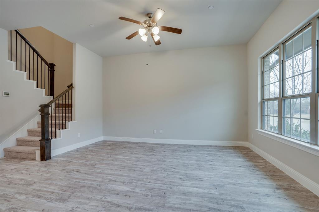 6217 Rainbow Valley Place Frisco, TX 75035 - Photo 9 of 30 wooden floor in an empty room with a window