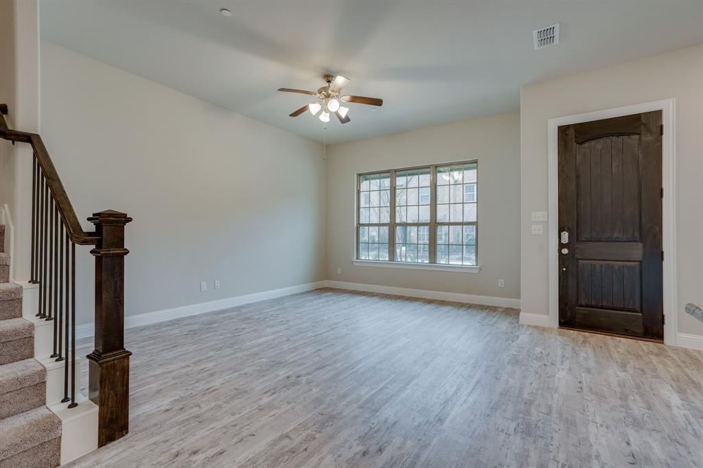 6217 Rainbow Valley Place Frisco, TX 75035 - Photo 10 of 30 a view of an empty room with a window and wooden floor