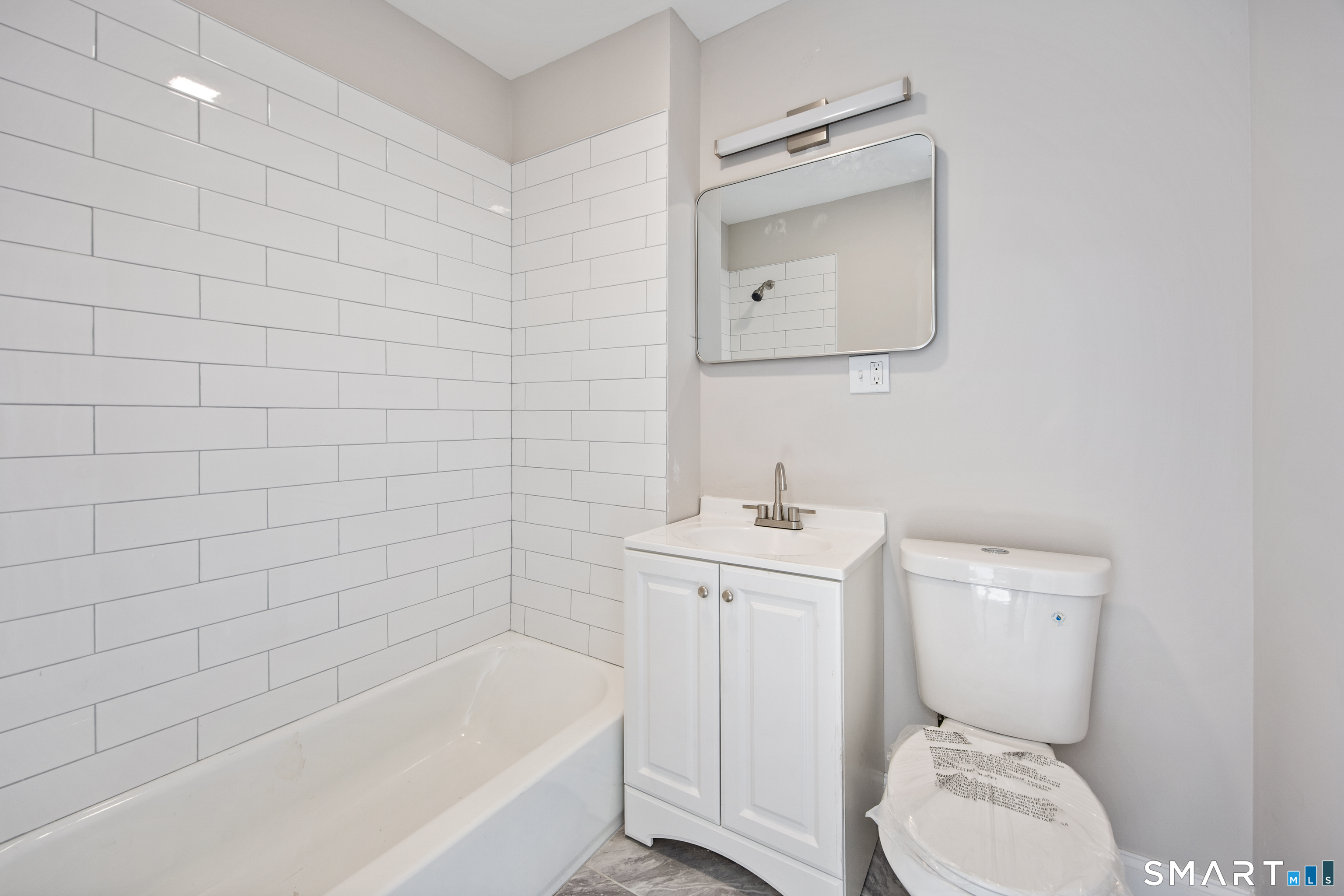 465 Washington Avenue Waterbury, CT 06708 - Photo 24 of 34 a bathroom with a sink a toilet and bathtub