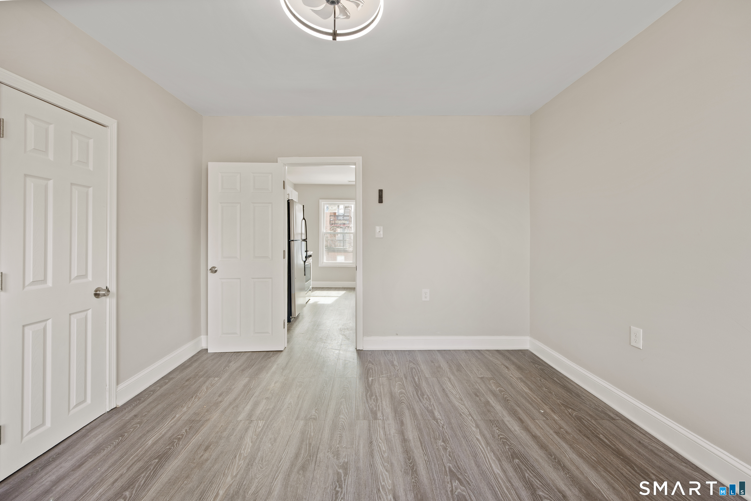 465 Washington Avenue Waterbury, CT 06708 - Photo 26 of 34 a view of a room with wooden floor and white walls