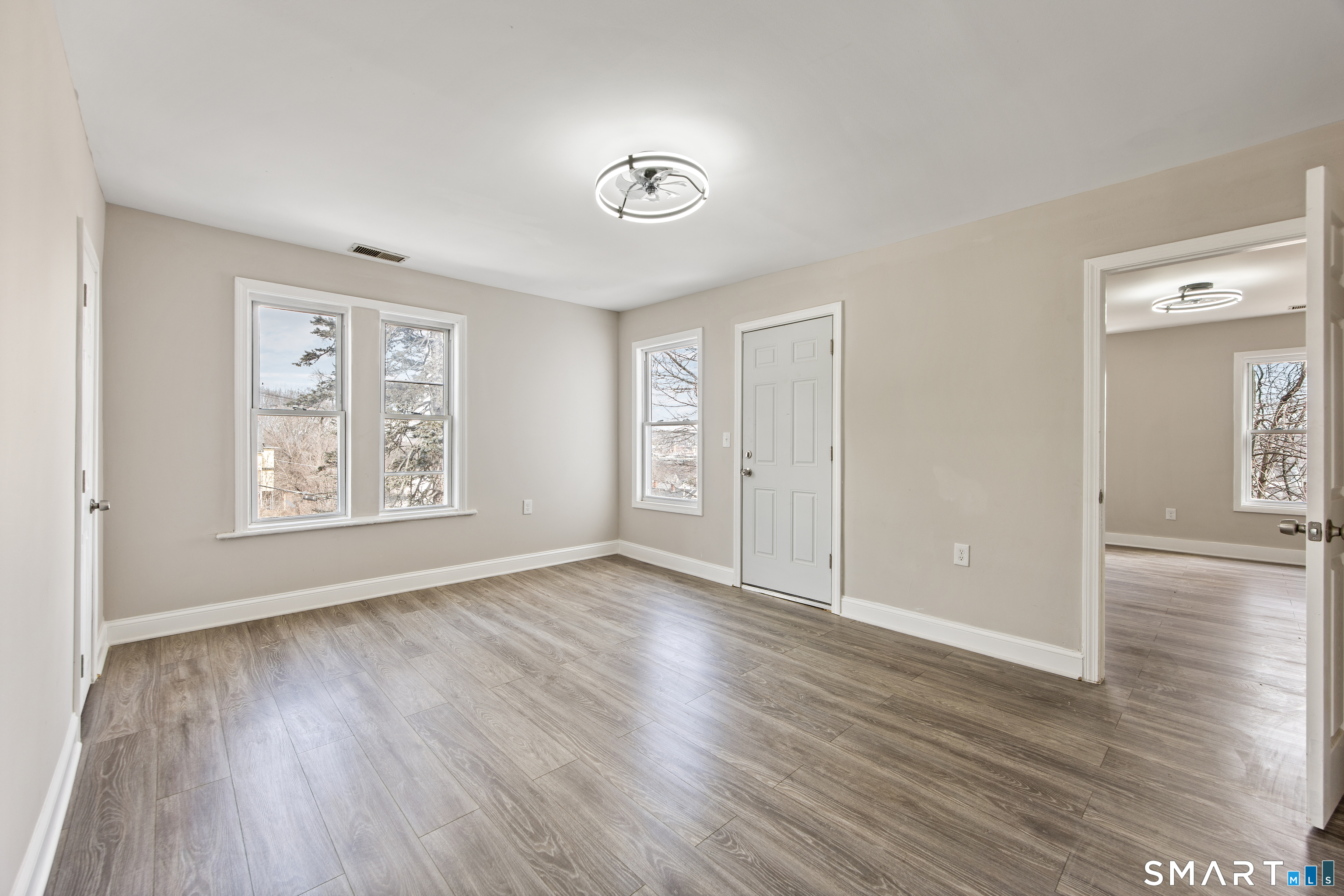 465 Washington Avenue Waterbury, CT 06708 - Photo 27 of 34 a view of an empty room with window and wooden floor