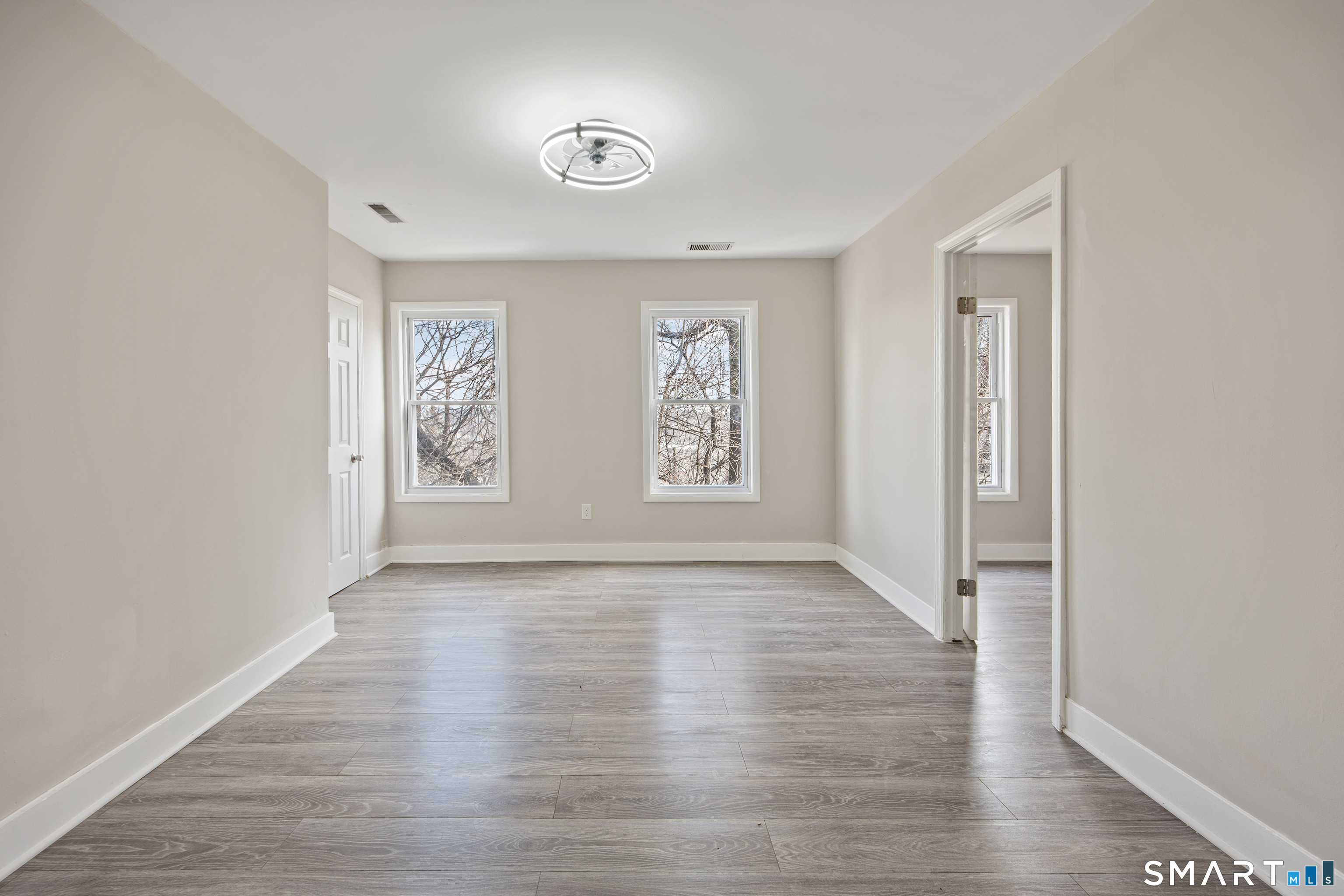 465 Washington Avenue Waterbury, CT 06708 - Photo 28 of 34 an empty room with wooden floor and windows