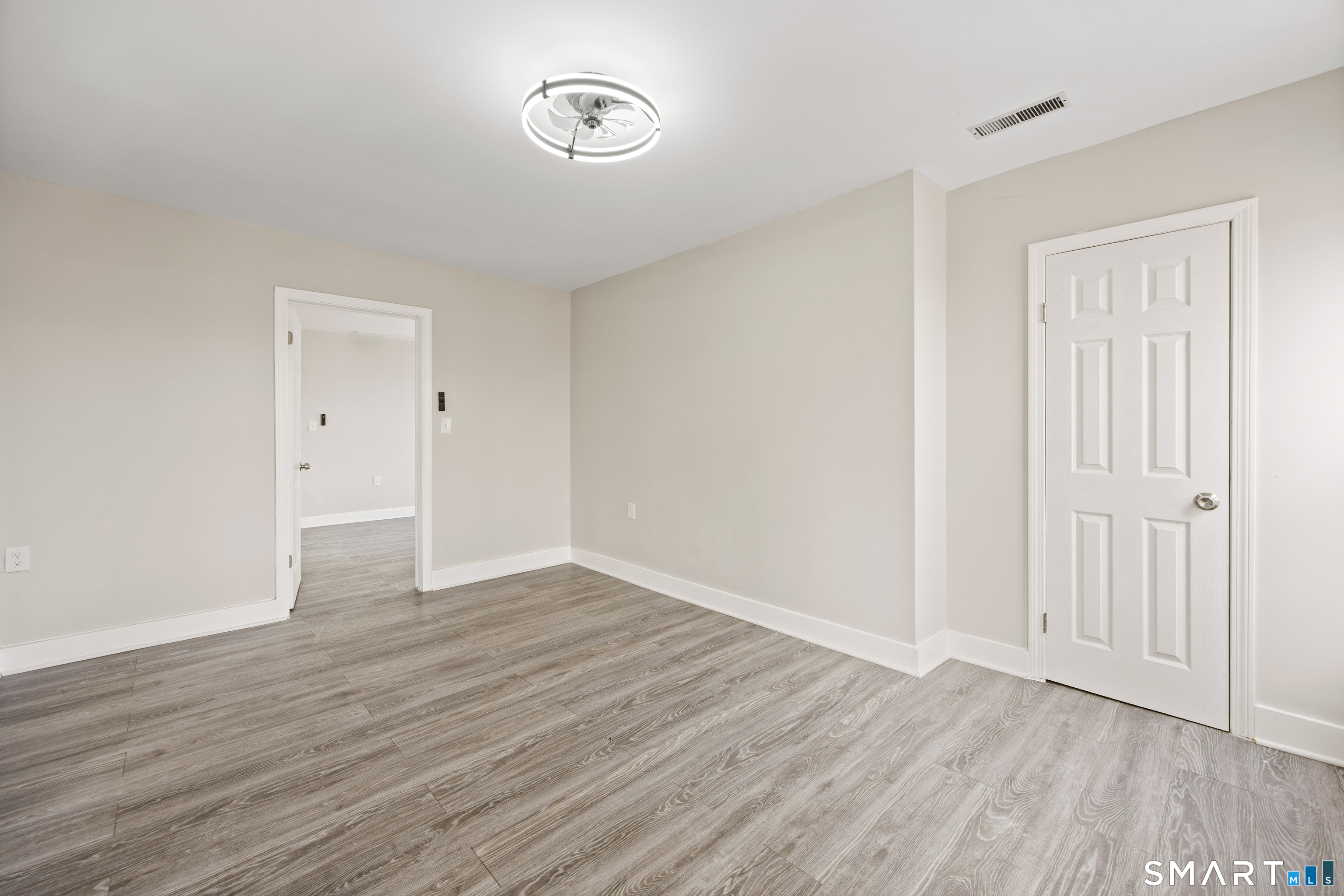 465 Washington Avenue Waterbury, CT 06708 - Photo 30 of 34 a view of an empty room with wooden floor