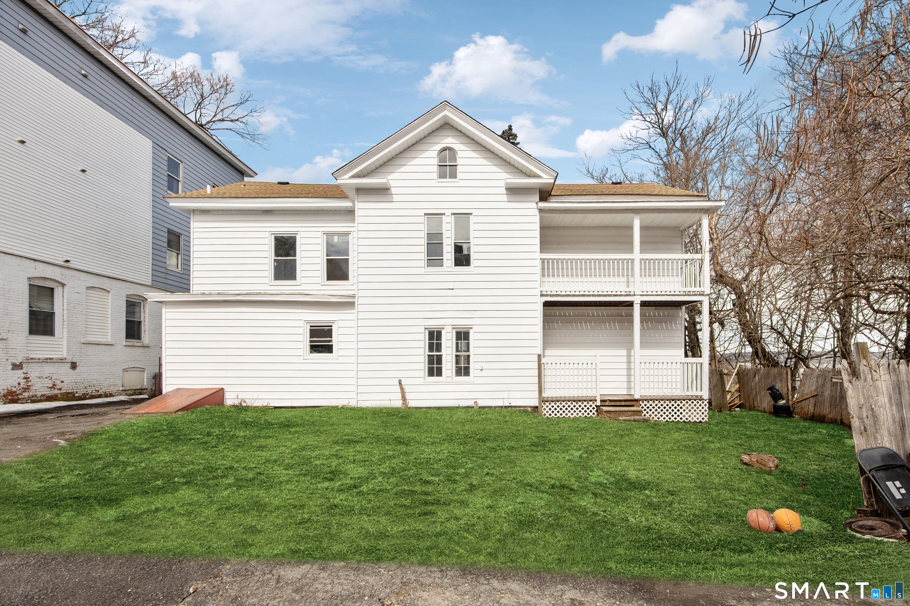 465 Washington Avenue Waterbury, CT 06708 - Photo 32 of 34 a front view of a house with a garden