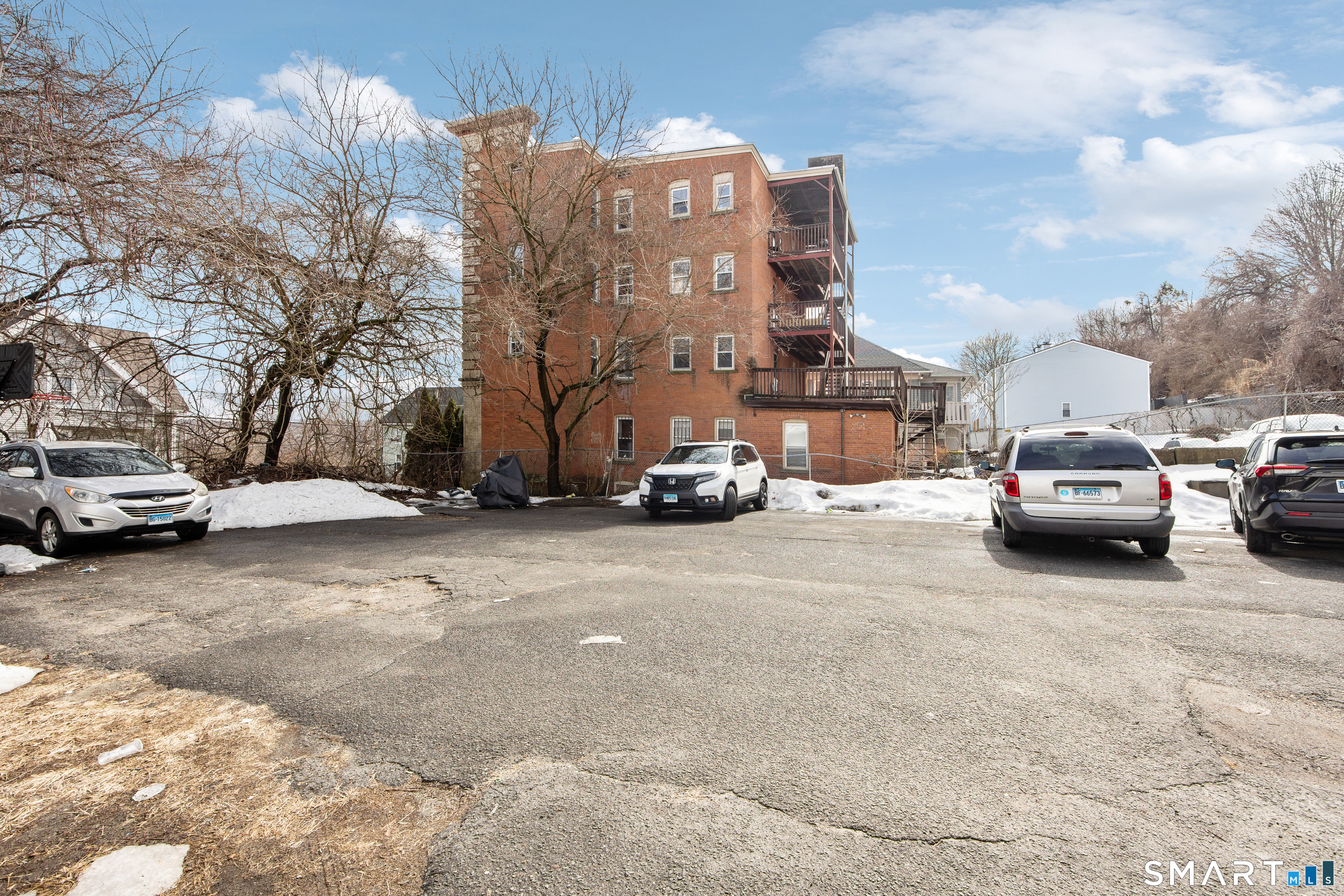 465 Washington Avenue Waterbury, CT 06708 - Photo 34 of 34 a view of cars parked in front of a building