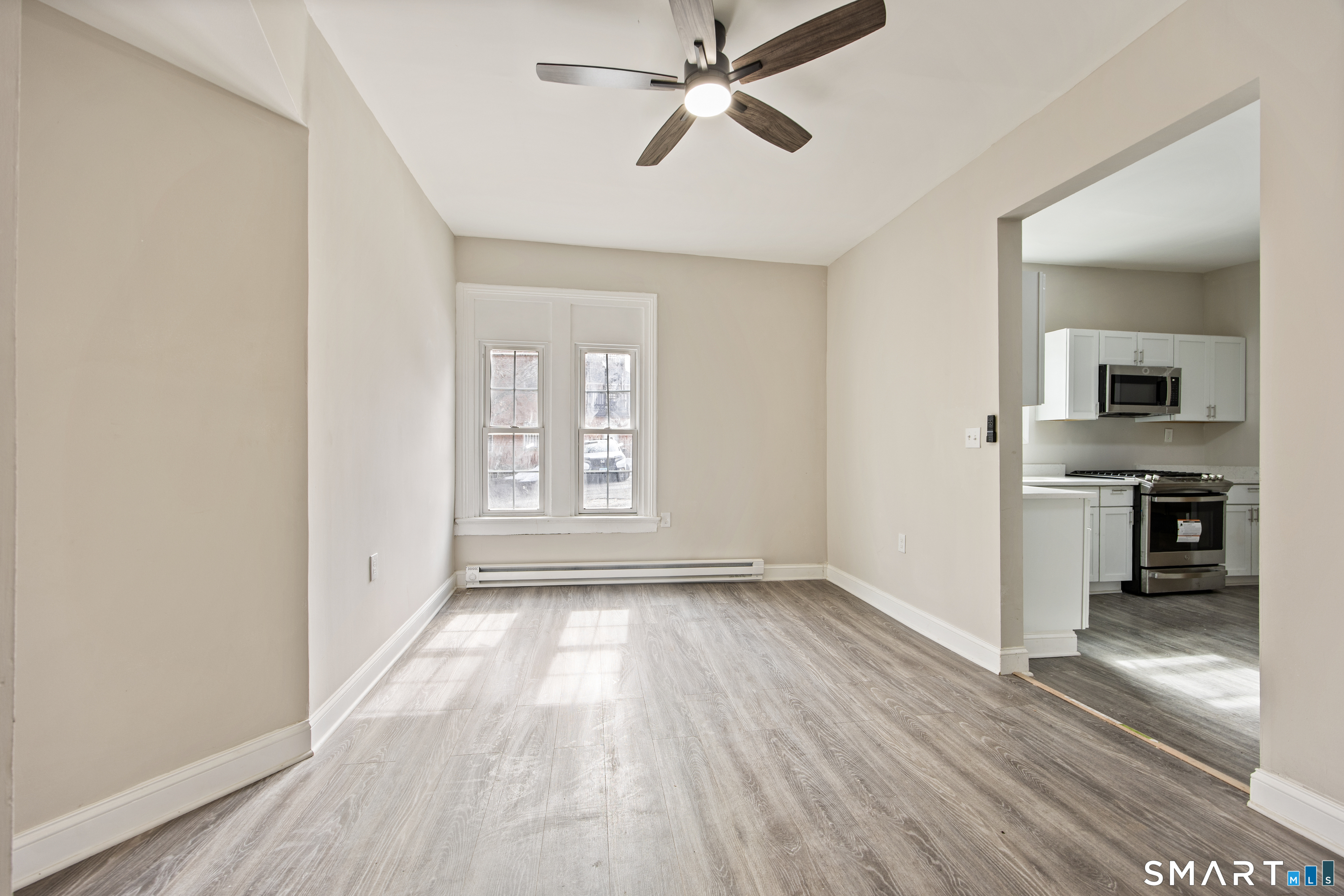465 Washington Avenue Waterbury, CT 06708 - Photo 6 of 34 wooden floor in an empty room with a window