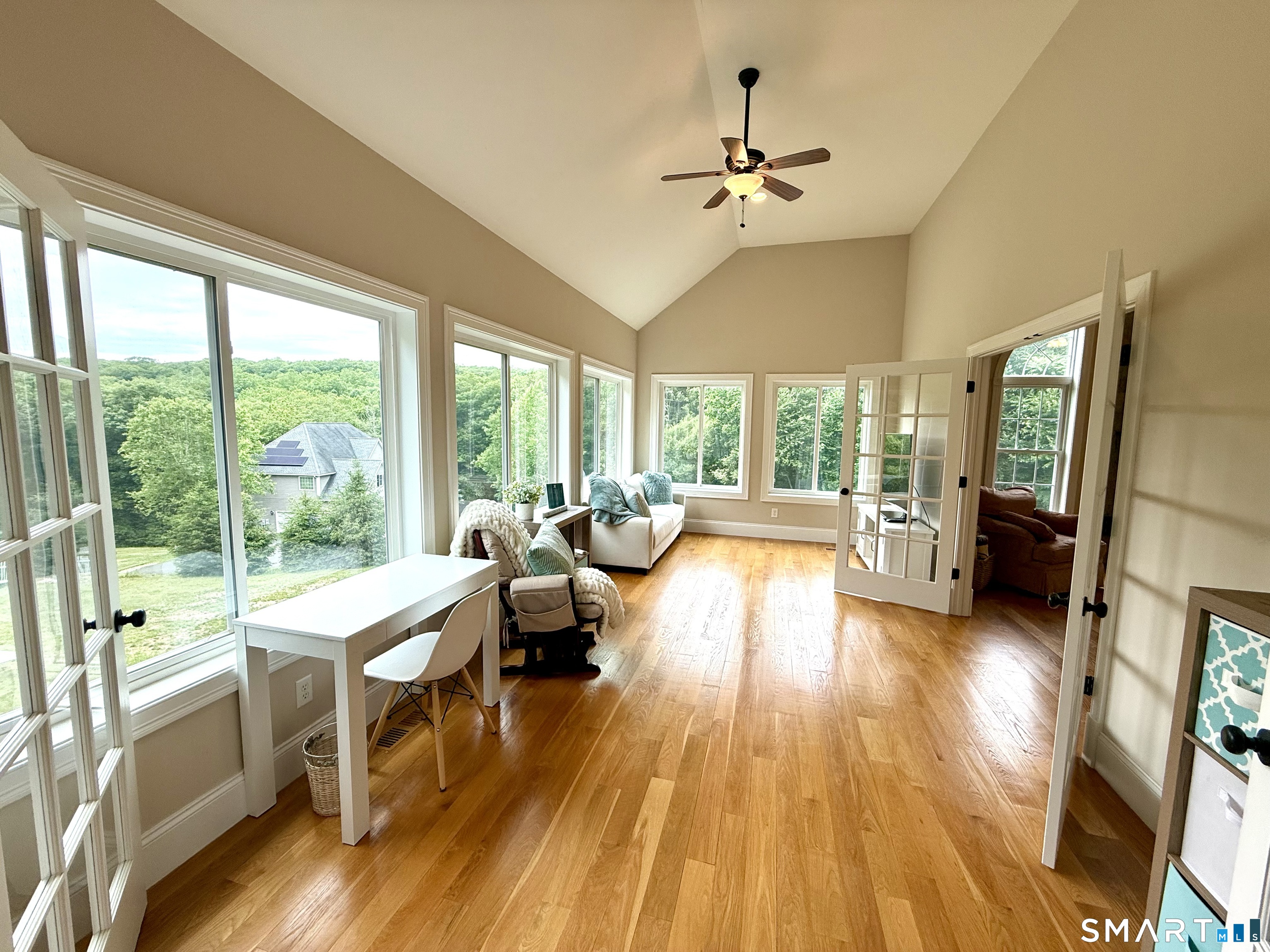 46 Hoseye Coach Road Newtown, CT 06482 - Photo 7 of 36 Wonderful sunroom is ideal for playroom or room to read and relax. also with volume ceiling.