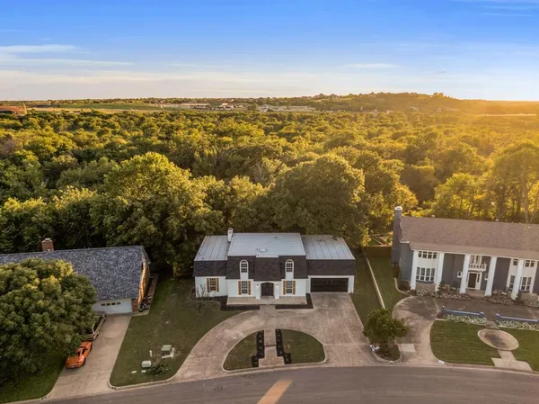 an aerial view of a house with a garden