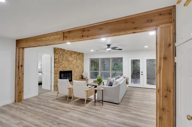 a living room with furniture and a fireplace