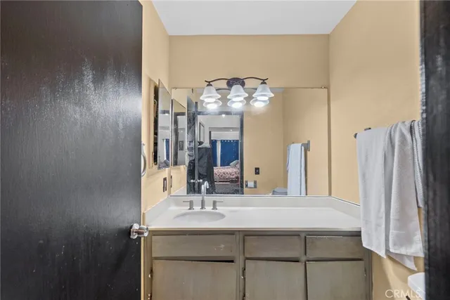 a bathroom with a sink and a mirror
