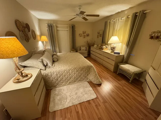 a street sign that is sitting in front of flowers