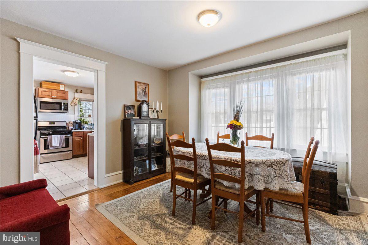 206 Washington Road Princeton, NJ 08540 - Photo 11 of 34 a dining room with furniture and wooden floor