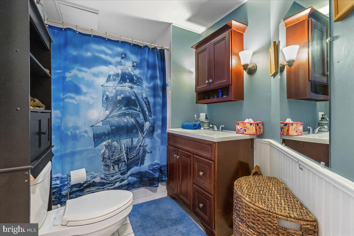 206 Washington Road Princeton, NJ 08540 - Photo 17 of 34 a bathroom with a sink vanity mirror and toilet