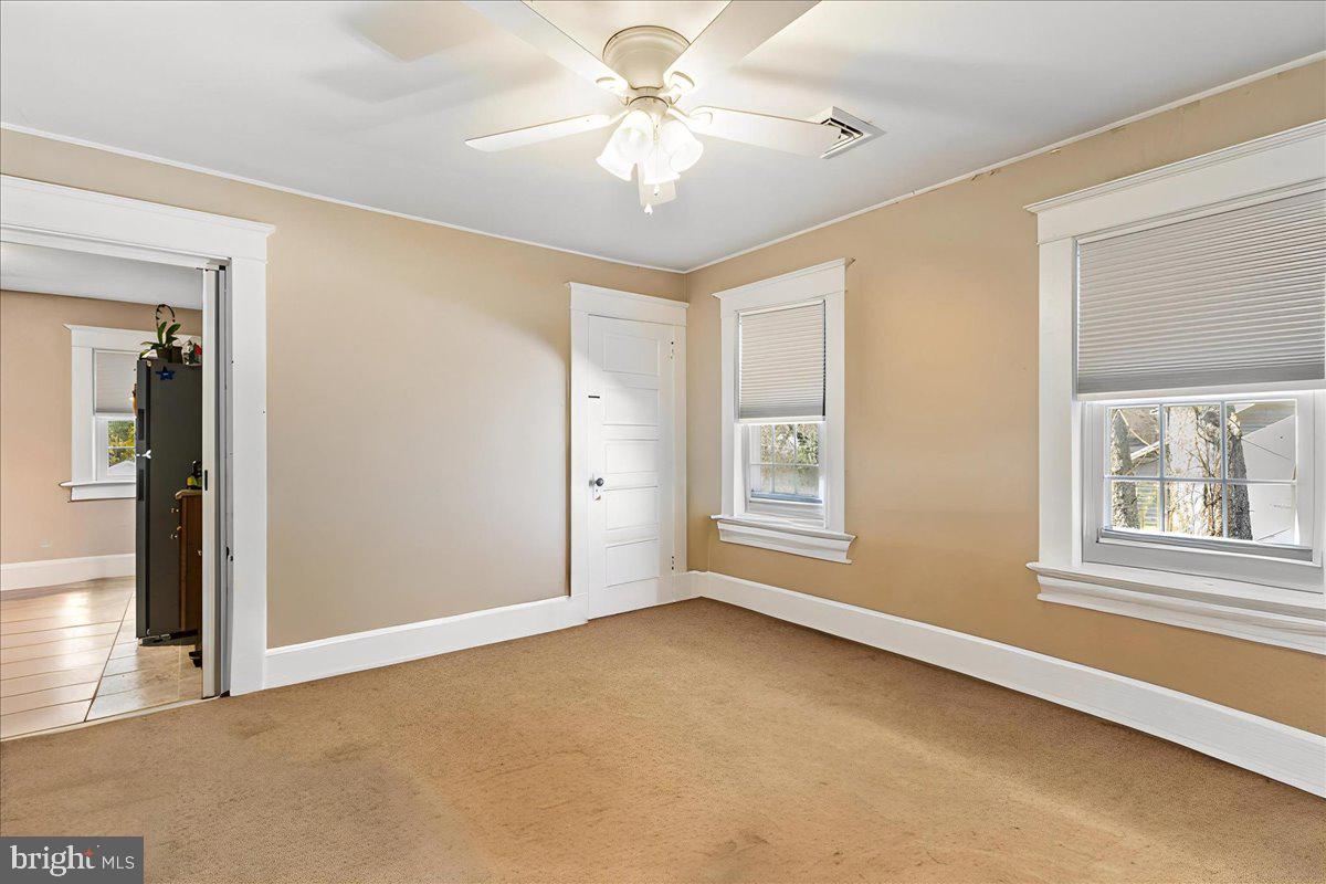 206 Washington Road Princeton, NJ 08540 - Photo 19 of 34 an empty room with windows and fan