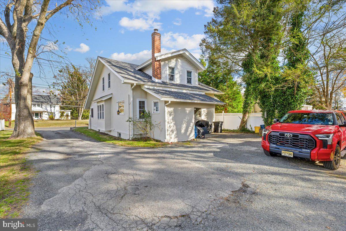 206 Washington Road Princeton, NJ 08540 - Photo 26 of 34 a car parked in front of a white house
