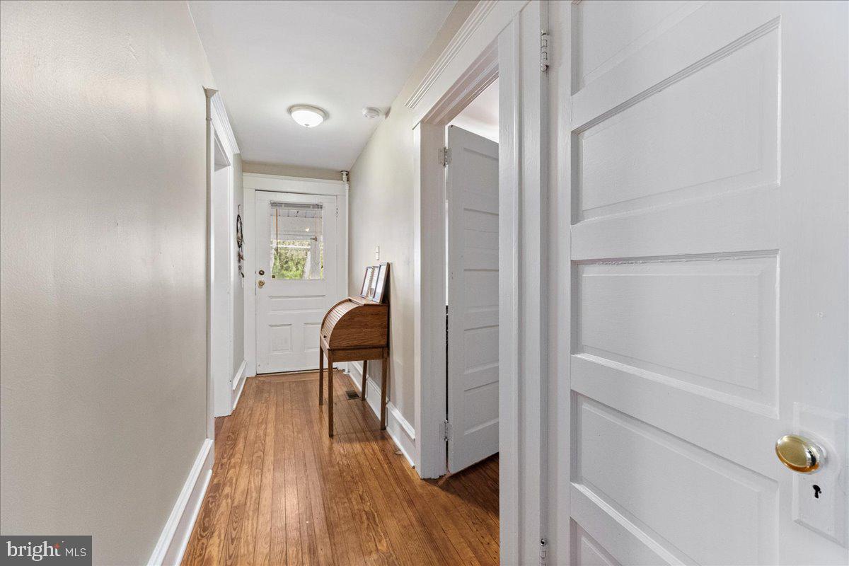 206 Washington Road Princeton, NJ 08540 - Photo 9 of 34 a view of a hallway with wooden floor and furniture