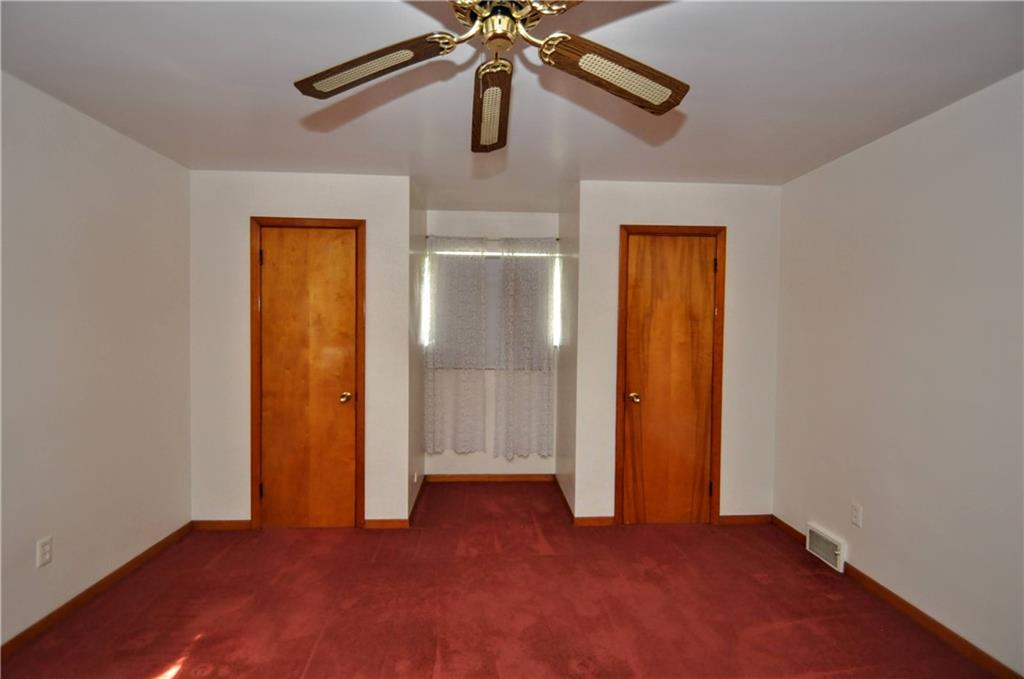 880 Peairs Road Elizabeth, PA 15037 - Photo 13 of 33 an empty room with closet and a chandelier fan