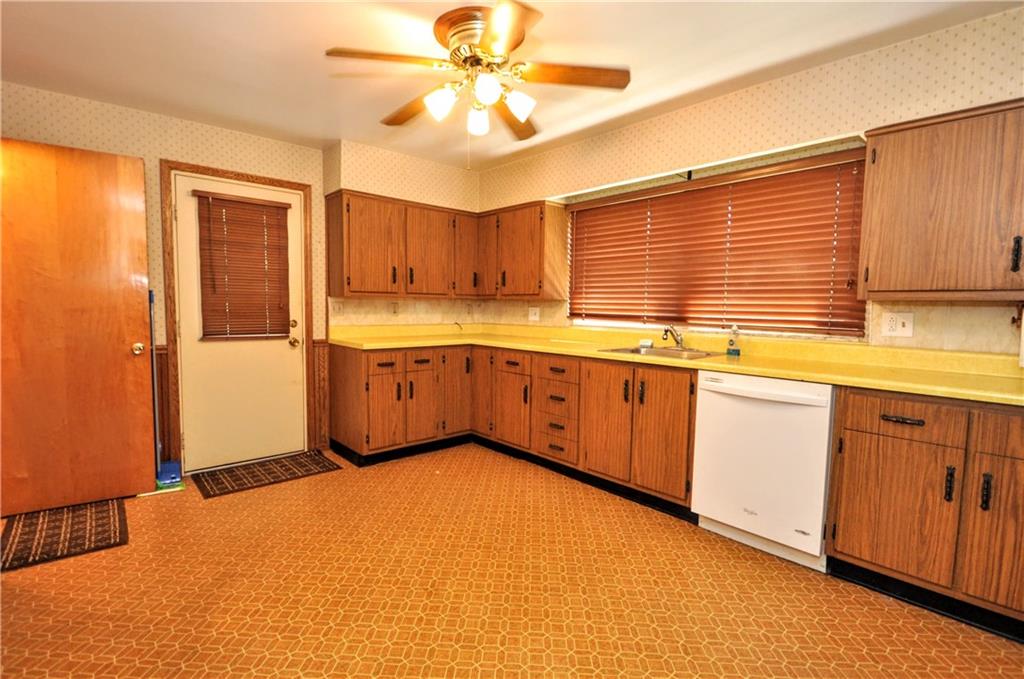 880 Peairs Road Elizabeth, PA 15037 - Photo 7 of 33 a kitchen with stainless steel appliances granite countertop a sink and cabinets