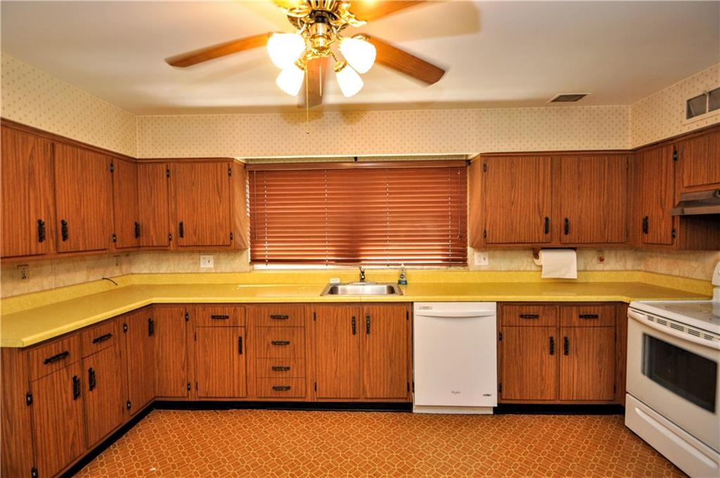 880 Peairs Road Elizabeth, PA 15037 - Photo 8 of 33 a kitchen with a sink window and cabinets