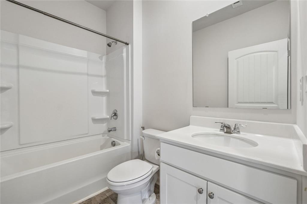 96 Quail Bend Way Dallas, GA 30157 - Photo 37 of 57 a bathroom with a sink toilet and a bathtub