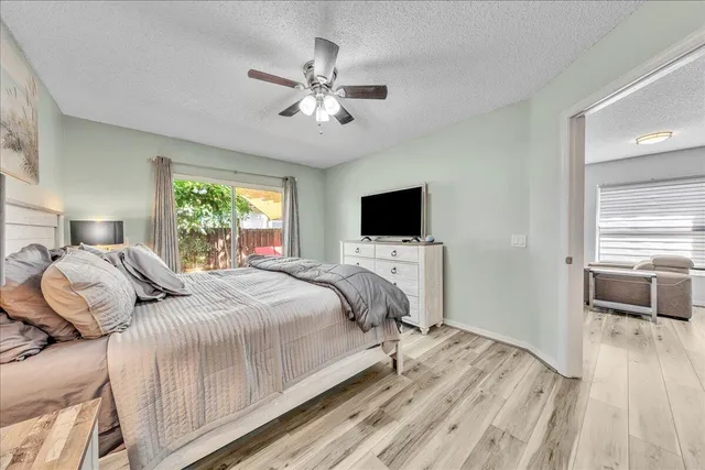 a view of a hallway with closet and bathroom