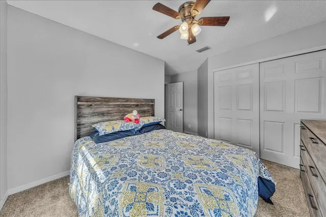 an aerial view of a house with garden space and street view