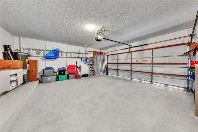 an aerial view of a house with garden space and street view