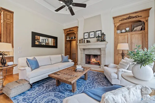 a living room with furniture and a fireplace