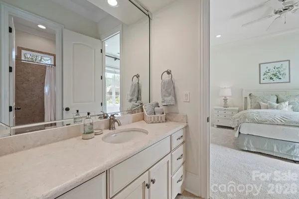 a en suite bathroom with double sink and a mirror