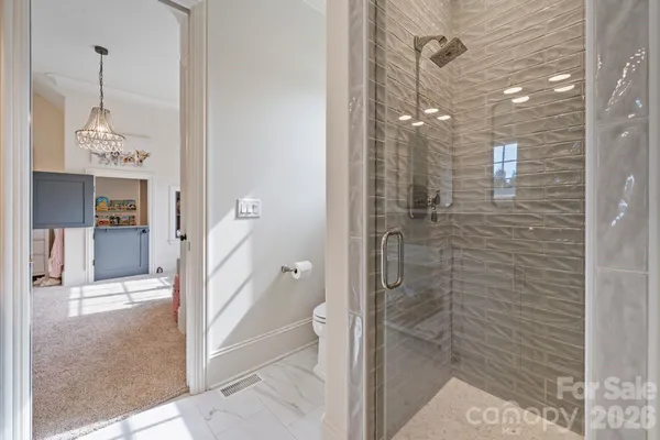 a bathroom with a shower and a sink