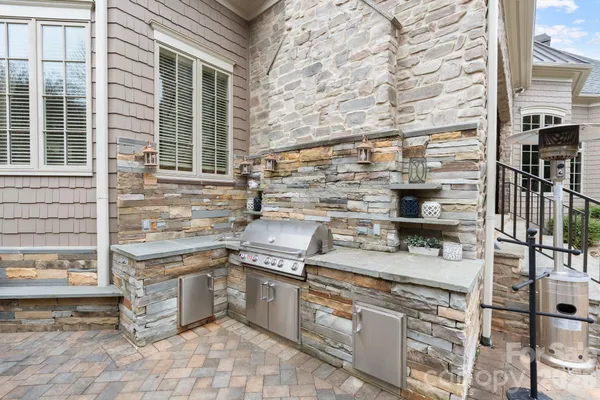 a kitchen with stainless steel appliances granite countertop a stove and a refrigerator