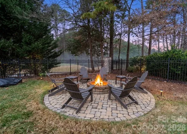 a view of a backyard with sitting area