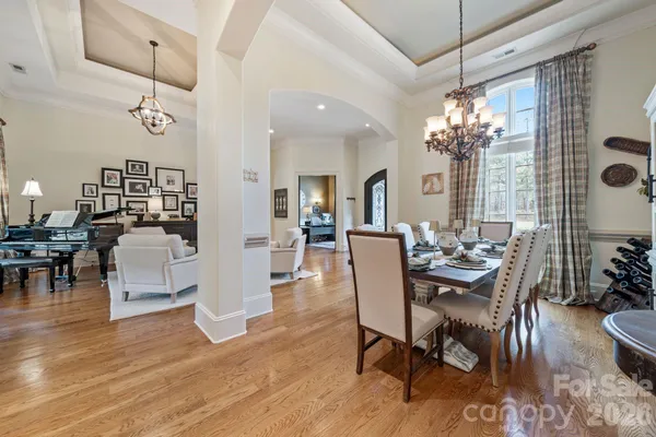 a view of a dining room with furniture and wooden floor