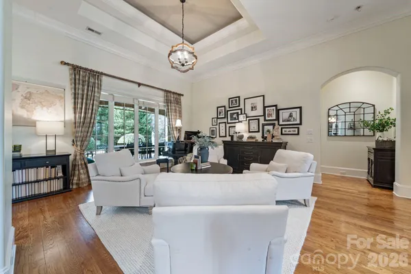 a living room with fireplace furniture and a wooden floor
