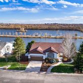 an aerial view of a house with a yard and potted plants