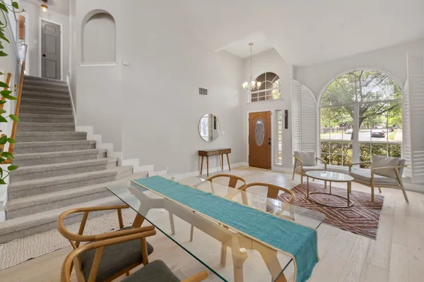 a view of living room filled with furniture and window