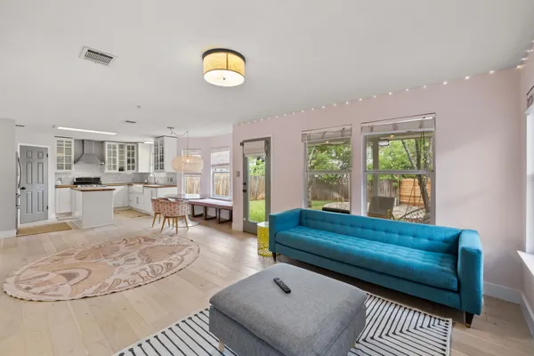 a living room with furniture and a large window